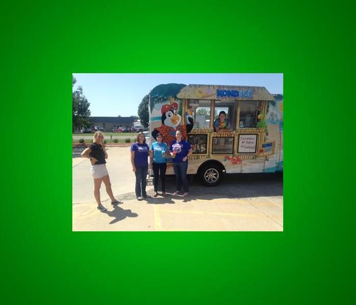 4 of our clients standing by the Kona Ice truck