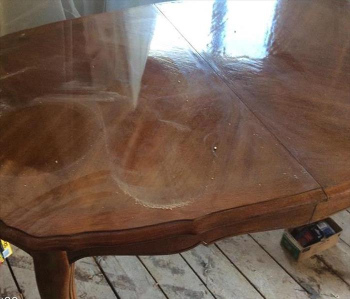 A wood table from a home that suffered from a fire